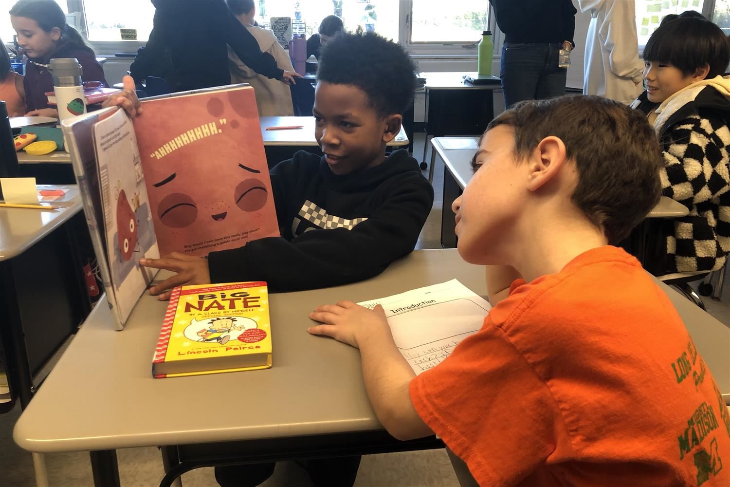  students reading book together
